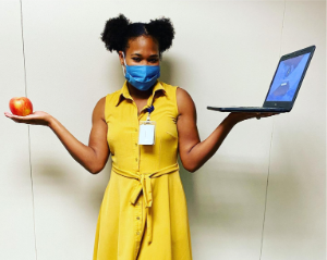 Photo of a lady with a laptop in hand