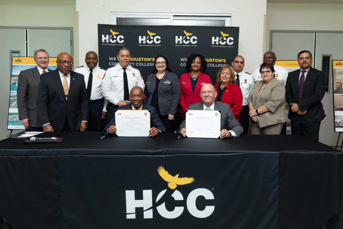 Houston Mayor Sylvester Turner and HCC Chancellor Cesar Maldonado sign a three-year training agreement at HCC’s Northeast College, surrounded by college leaders, trustees and Fire Department executive team members.