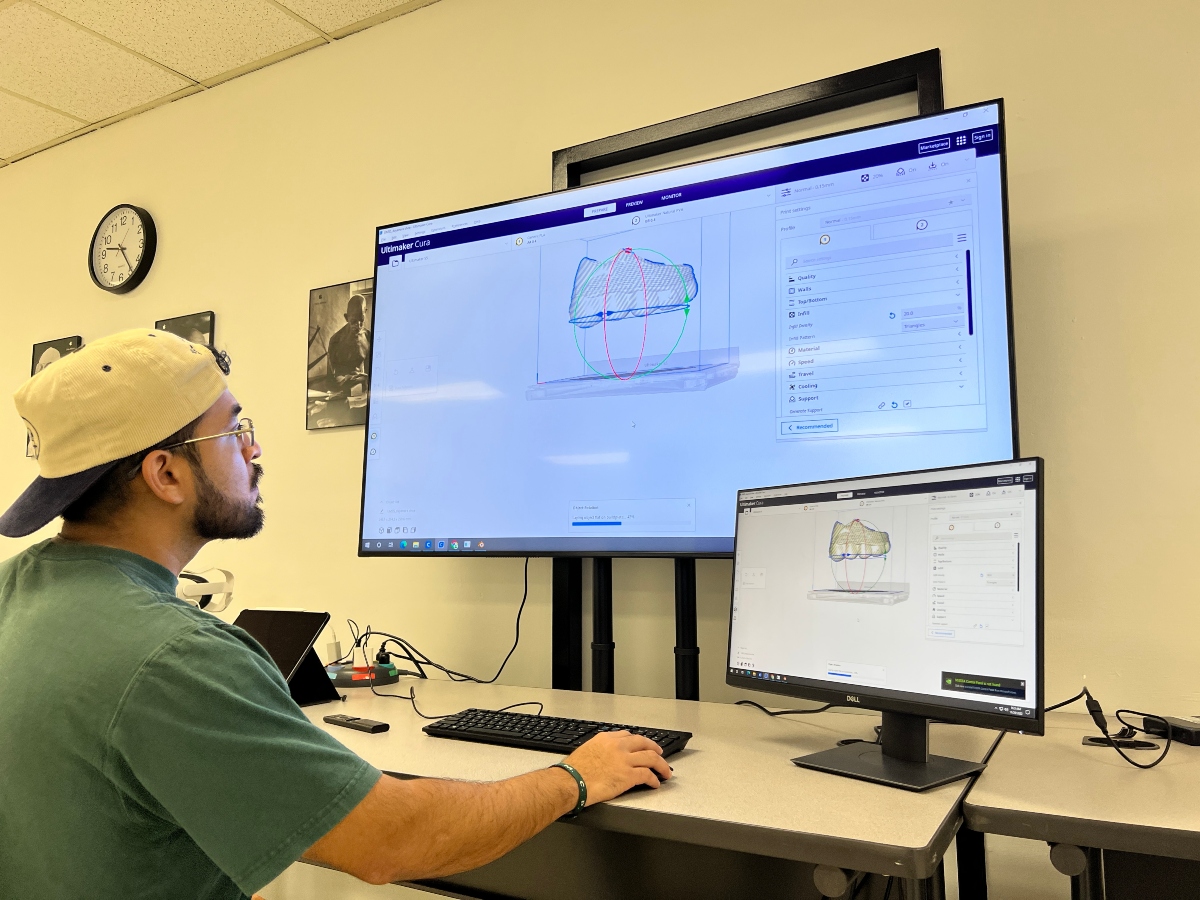 A student designs a shoe on a computer screen