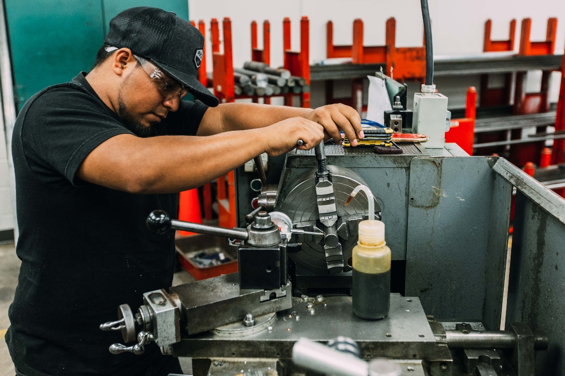 A student uses machinery.